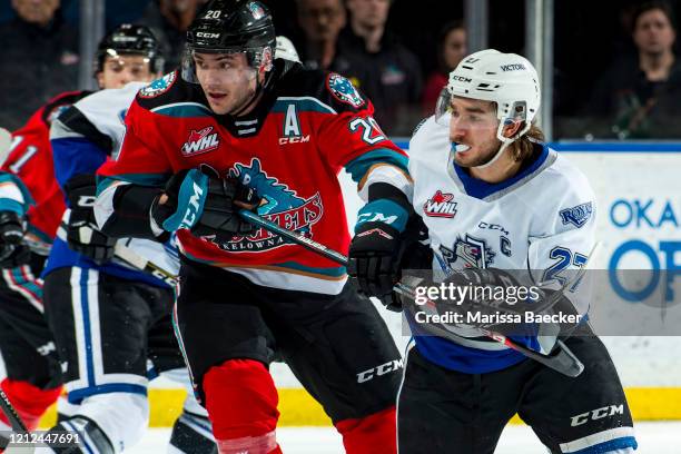 Matthew Wedman of the Kelowna Rockets stick checks Phillip Schultz of the Victoria Royals at Prospera Place on March 11, 2020 in Kelowna, Canada.