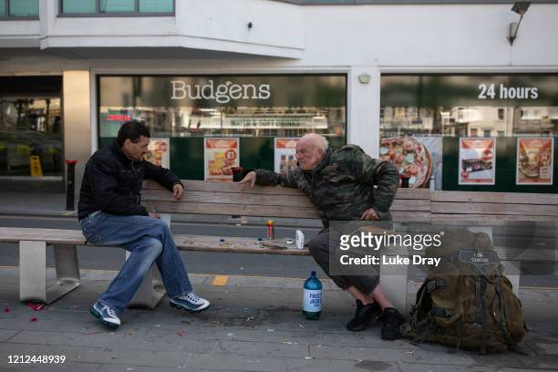 Alex and Gary , both homeless veterans who have been on the streets for 14 and 7 years respectively, interact outside Brighton Station on May 9, 2020...