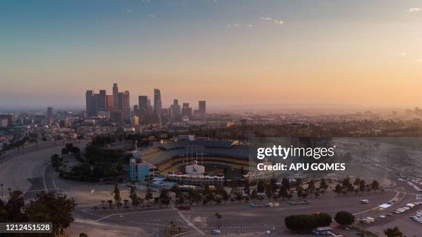 An aerial view shows the Dodger Stadium in Los Angeles, California, on May 9 during the novel coronavirus pandemic. - Events that involve mass...