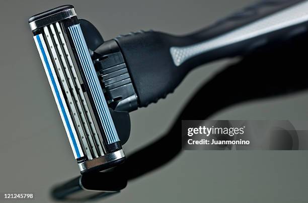 brand new male razor gray and blue color - scheermes stockfoto's en -beelden