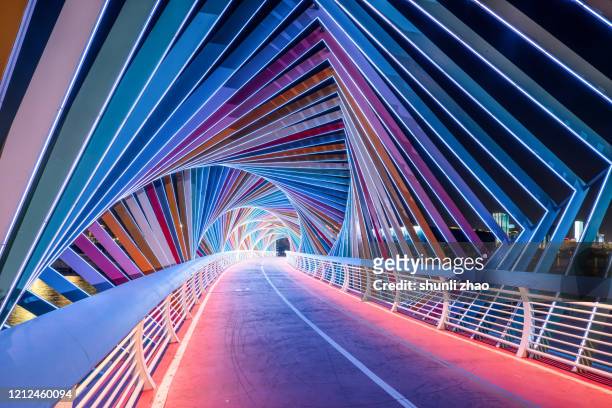 rainbow bridge at night - qingdao beach stock pictures, royalty-free photos & images