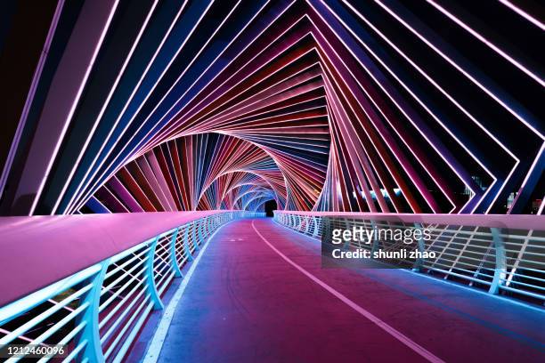 rainbow bridge at night - illuminated stock pictures, royalty-free photos & images