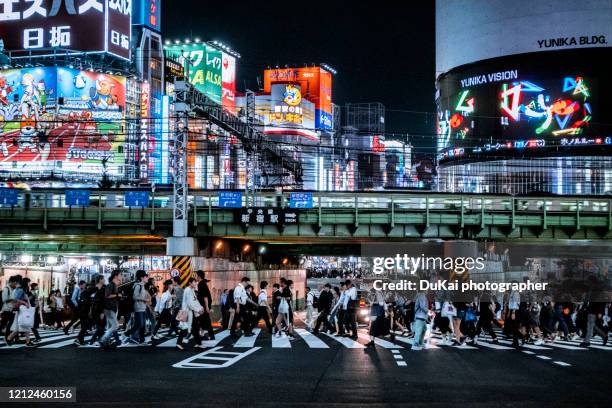 shinjuku  busy transportation rush hour at night - shinjuku stock pictures, royalty-free photos & images