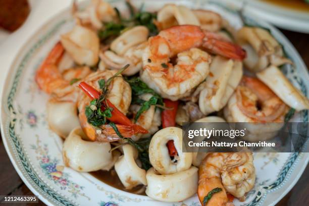 stir fried basil with seafood meat - stock photo - seafood salad stock pictures, royalty-free photos & images