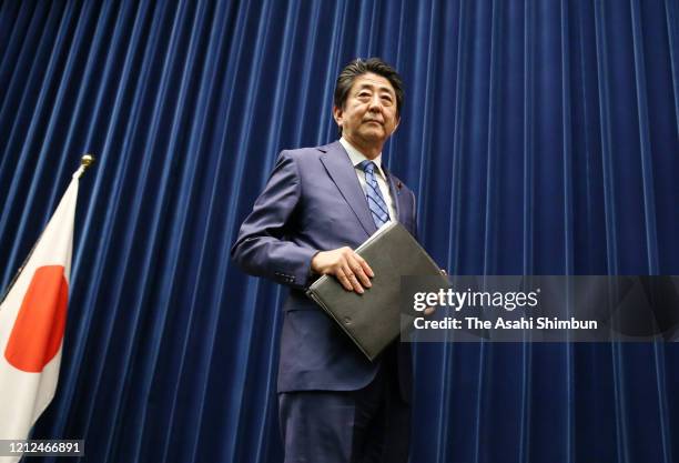 Prime Minister Shinzo Abe leaves after a press conference at the prime minister's official residence on March 14, 2020 in Tokyo, Japan.