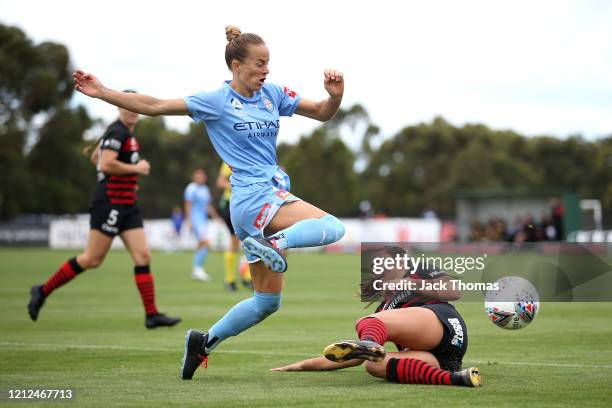 Aivi Luik of Melbourne City is challenged by Sam Staab of Western Sydney Wanderers during the W-League Semi Final match between Melbourne City and...