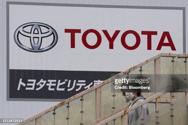 Signage is displayed outside a Toyota Motor Co. Dealership in Tokyo, Japan, on Sunday, May 10, 2020. Global automakers and suppliers are on track to...
