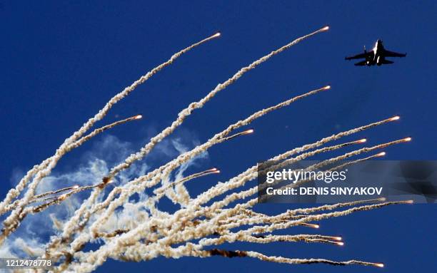 Russian aerobatic team 'Russian warriors' performs during a demonstration flight at the Moscow International Air Show at Zhukovsky, some 50 kms...