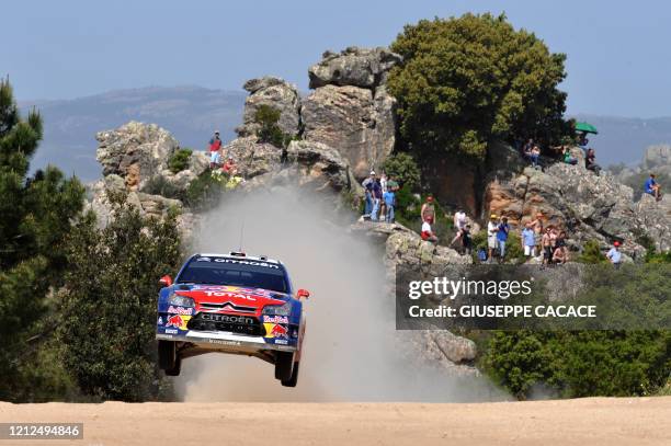 French driver Sebastien Loeb and co-driver Daniel Elena power the Citroen C4 WRC during the Crastazza special stage on the first day of the Italian...