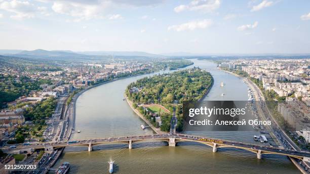 aerial photo shows the margaret island and the margaret bridge in budapest, hungary - beautiful blue danube stock pictures, royalty-free photos & images