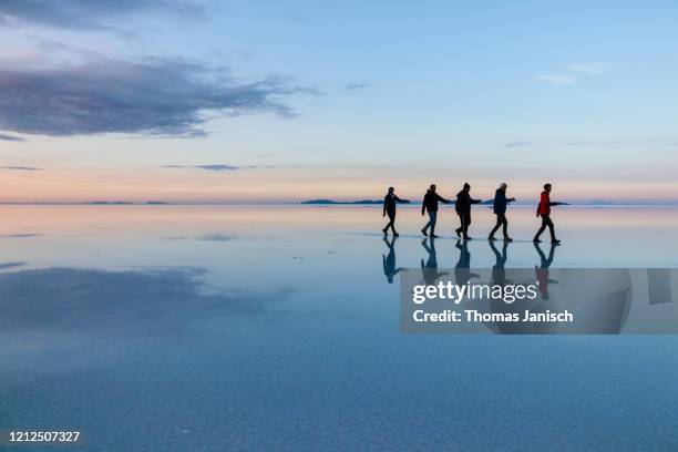 reflection on the salar de uyuni, bolivia - salt flat stock pictures, royalty-free photos & images