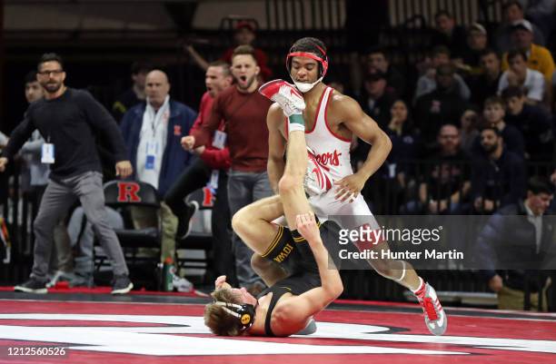 Chad Red of the Nebraska Cornhuskers wrestles Max Murin of the Iowa Hawkeyes during the Big Ten Championships at Rutgers Athletic Center on the...