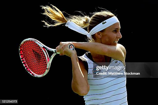 Gisella Dulko of Argentina returns a shot to Shuai Peng of China during the Western & Southern Open at the Lindner Family Tennis Center on August 16,...