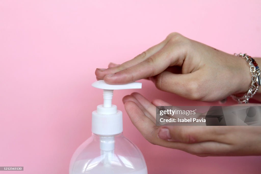 Close up of hands applying hand soap