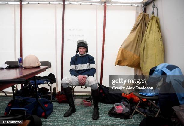 Jockey Alex Chadwick looks on in the changing room during Point-to-Point Racing at High Easter on March 15, 2020 in Chelmsford, England.