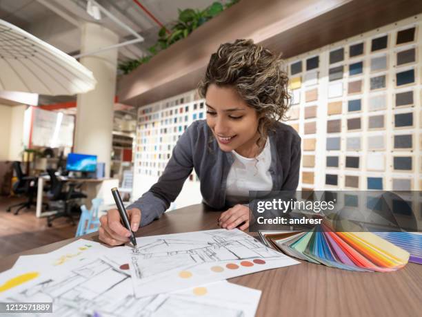 interior designer drawing sketches while shopping at a furniture store - interior designer stock pictures, royalty-free photos & images