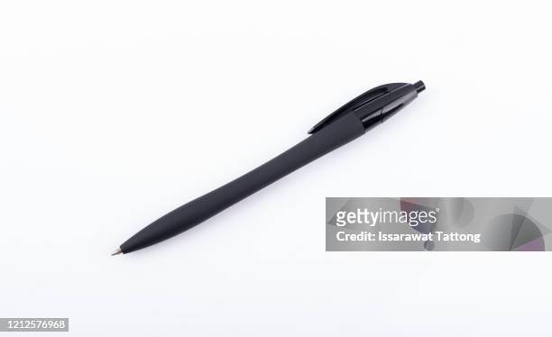 black pen isolated on white background - caneta esferográfica - fotografias e filmes do acervo