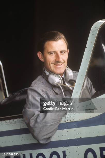 Graham Hill , British racing driver and team owner, in cockpit of his airplane, 1965.