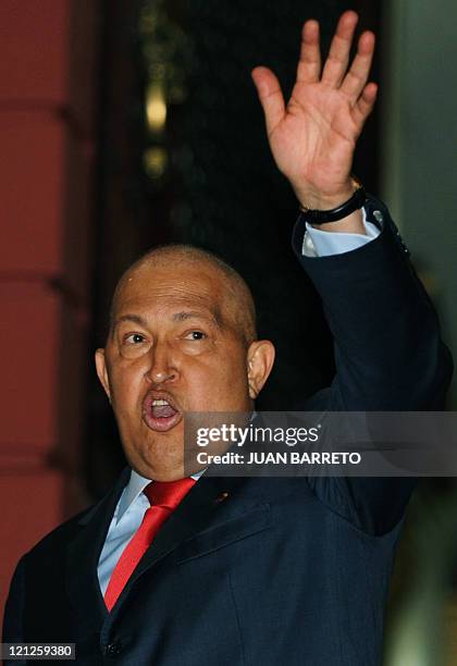 Venezuelan President Hugo Chavez waves after a meeting with the South American Union of Nations Secretary General, Colombian Maria Emma Mejia , in...
