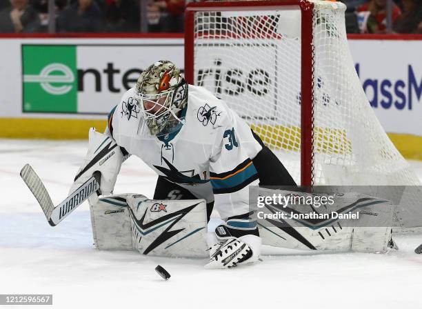 Aaron Dell of the San Jose Sharks drops to make a save against the Chicago Blackhawks at the United Center on March 11, 2020 in Chicago, Illinois.