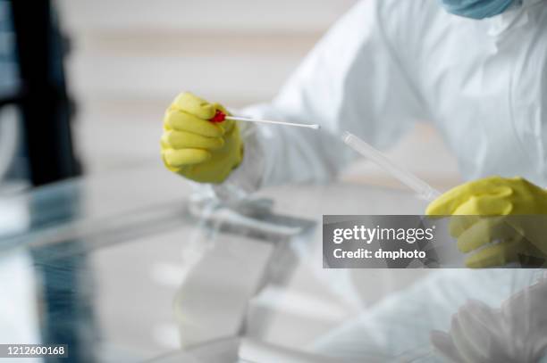 swab sampling - covid 19 testing stock pictures, royalty-free photos & images