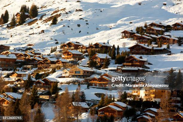 wooden cottages covered in snow in verbier - verbier ストックフォトと画像