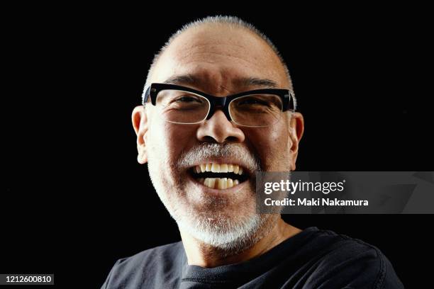 portrait of a man in his 50s. - smiling mature eyes stockfoto's en -beelden