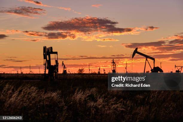 pumpjack at dusk in the permian basin - shale stock pictures, royalty-free photos & images