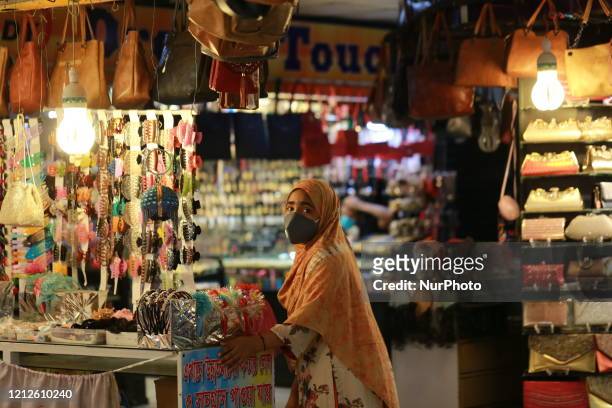 Woman visits a shop ahead of Eid-ul-Fitr after shopping malls reopen on a limited scale during the lockdown as a preventive measure against the...
