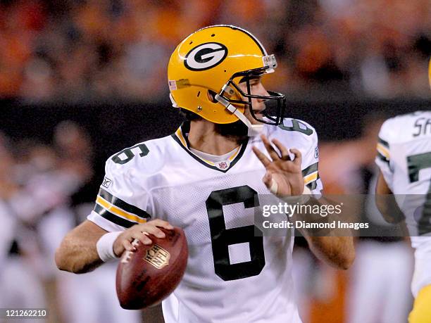 Quarterback Graham Harrell of the Green Bay Packers looks for an open receiver during a preseason game against the Cleveland Browns on August 13,...