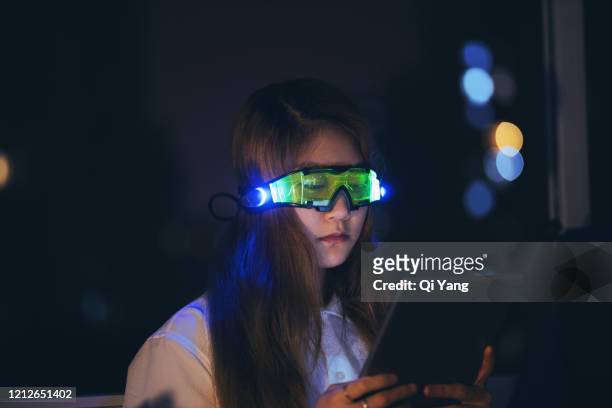 business woman wearing augmented reality glasses using digital tablet - smart glasses eyewear foto e immagini stock