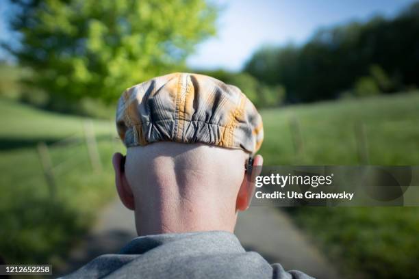 In this photo illustration you see the backside of a man wearing a hat on April 25, 2020 in Bonn, Germany.