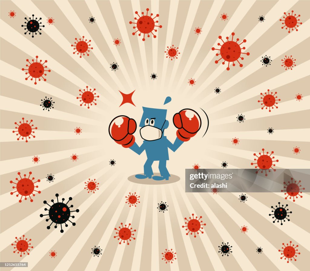 Homem azul usa máscara facial médica e luvas de boxe para lutar contra o novo coronavírus (gripe, bactéria, vírus, poluição do ar)