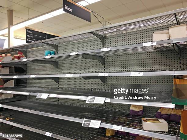 coronavirus, covid-19 pandemic, empty supermarket shelves from panic buying - sparse stock pictures, royalty-free photos & images