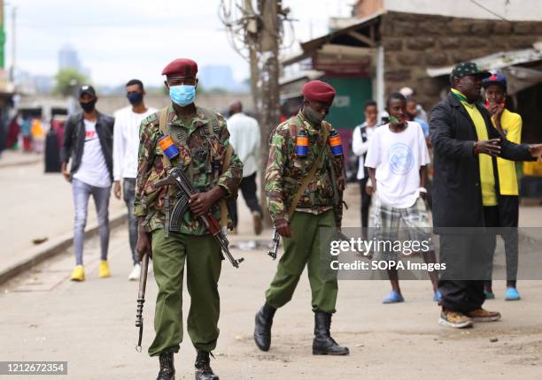 Police officers patrol the streets of Eastleigh during the demonstration. Eastleigh Residents took to the street to protest restriction of movement...