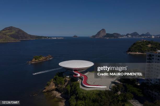 Aerial view of the city of Niteroi and its Contemporary Art Museum of Niteroi and the city of Rio de Janeiro in the background, during the first day...