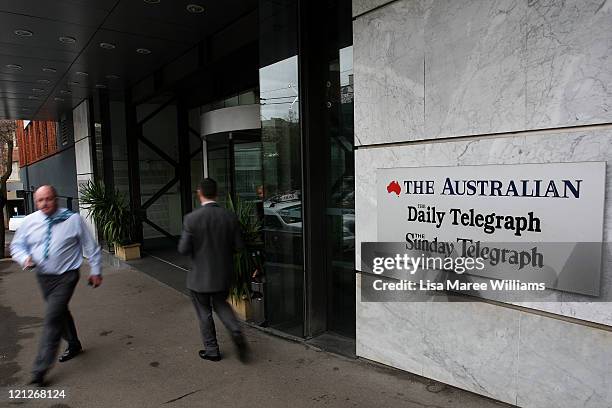 Pedestrians walk past the editorial headquarters of News Ltd, the Australian unit of News Corp on August 17, 2011 in Sydney, Australia. Australia's...