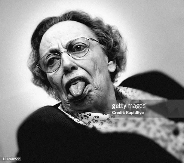 cheeky grandmother - crazy old lady stock pictures, royalty-free photos & images