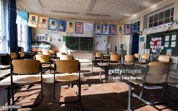 An empty class room of an elementary school is pictured on the first day of the school's temporary closure as part of nationwide measures to stem the...
