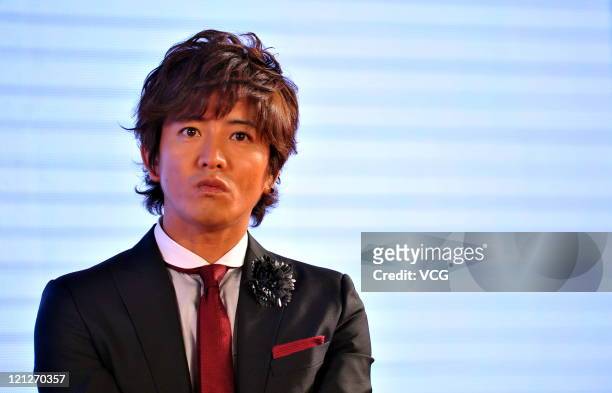 Takuya Kimura, member of Japanese boy band SMAP, attends a press conference to promote their Beijing concert at Westin Hotel on August 16, 2011 in...