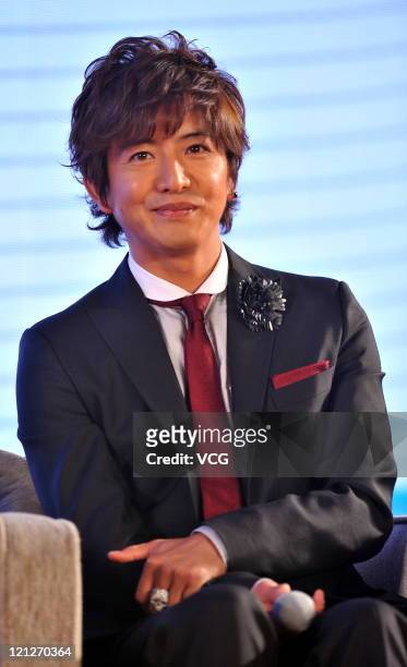 Takuya Kimura, member of Japanese boy band SMAP, attends a press conference to promote their Beijing concert at Westin Hotel on August 16, 2011 in...