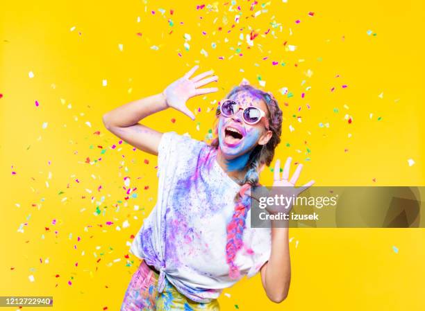 portrait of excited teenage girl on holi color festival - holi portraits stock pictures, royalty-free photos & images