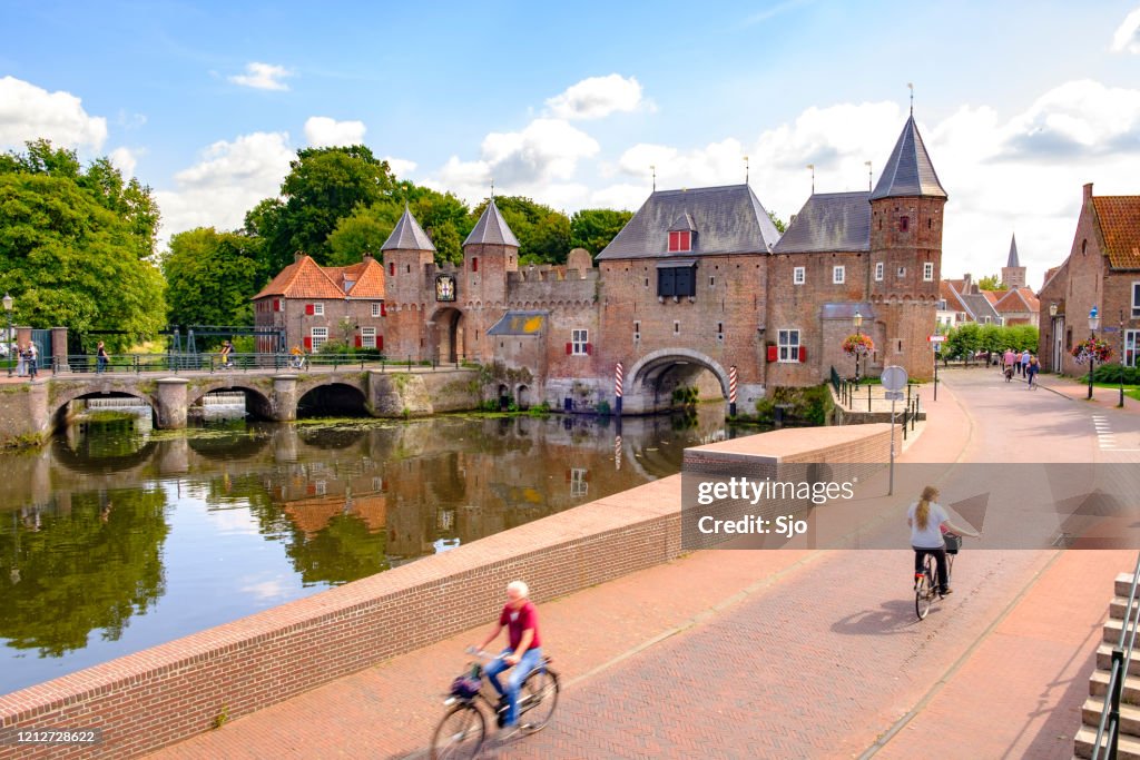 Medieval Koppelpoort town wall and gate over the Eem river in Amersfoort