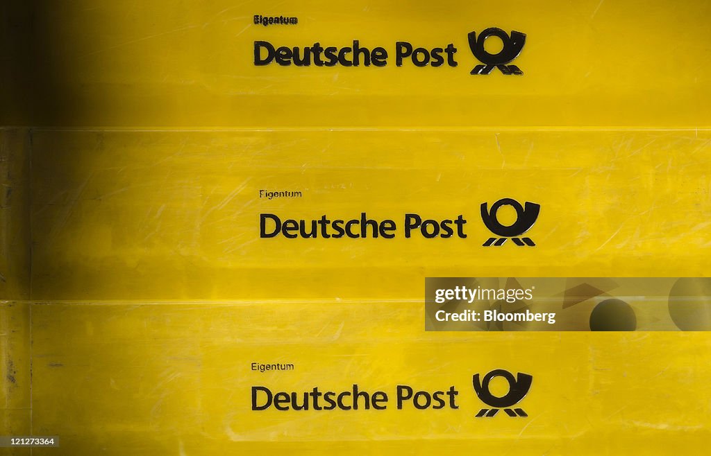 The Deutsche Post AG logo sits on the side of stacked mail boxes
