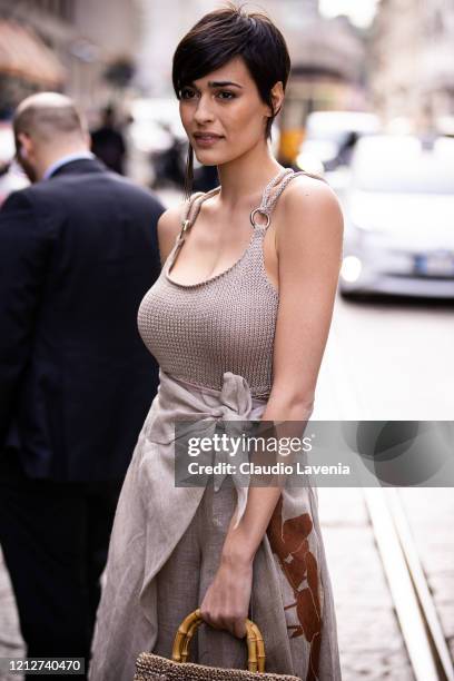 Alice Sabatini, wearing a beige knitted top and beige printed pants, is seen outside Anteprima show, during Milan Fashion Week Fall/Winter 2020-2021...