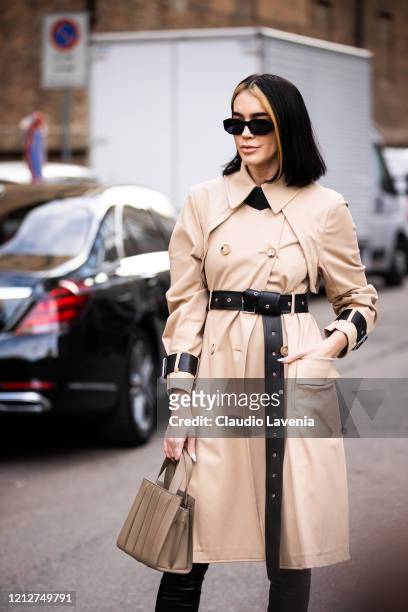 Brittany Xavier, wearing a beige leather trench coat, black leather pants and beige bag, is seen outside Max Mara show, during Milan Fashion Week...