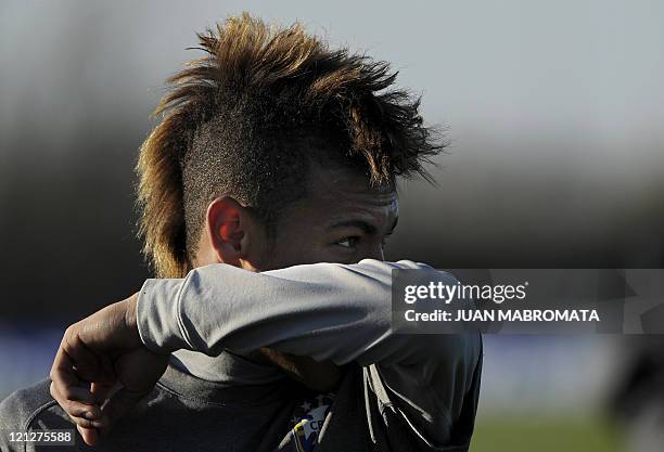 Brazil's forward Neymar gestures during a training session of the national football team near Campana, some 70 Km of Buenos Aires, on June 28 ahead...