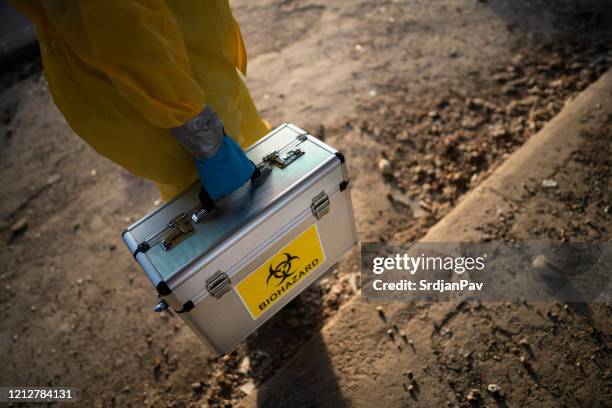carrying his lab on the field - hazardous area sign stock pictures, royalty-free photos & images