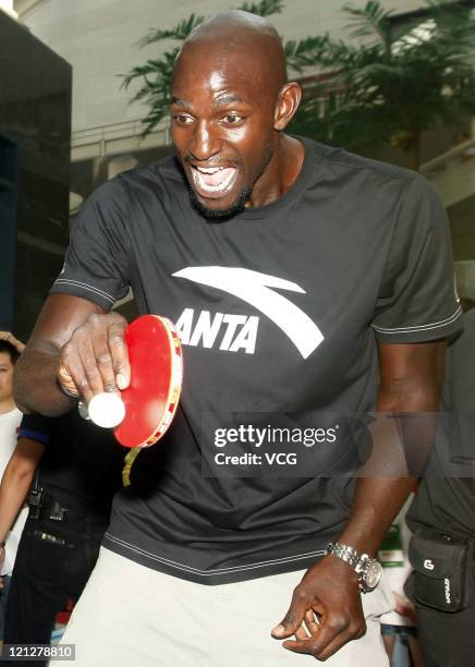 Kevin Garnett of Boston Celtics plays table tennis during ANTA commercial event on August 17, 2011 in Wuhan, Hubei Province of China.