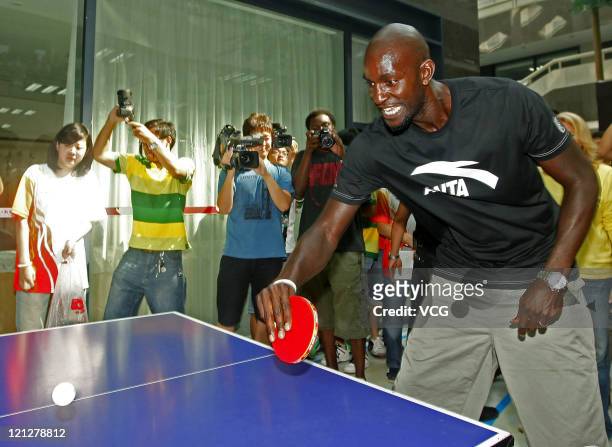 Kevin Garnett of Boston Celtics plays table tennis during ANTA commercial event on August 17, 2011 in Wuhan, Hubei Province of China.
